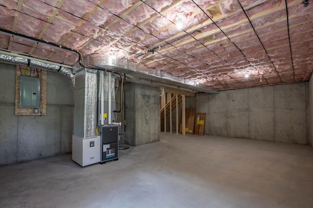 72 N Mast St Unit 1, Goffstown, NH 03045 - unfinished below grade area with electric panel and heating unit