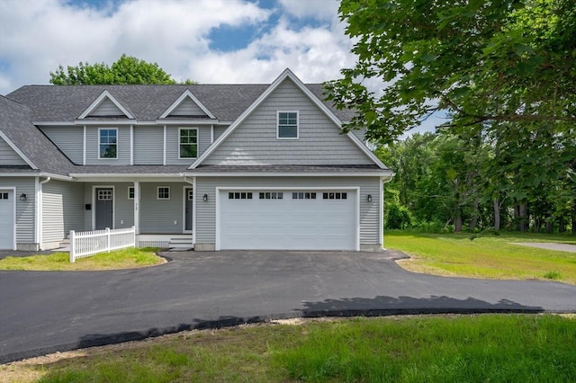 72 N Mast St Unit 1, Goffstown, NH 03045 - view of front facade featuring asphalt driveway, a garage, a shingled roof, a front yard, and a porch
