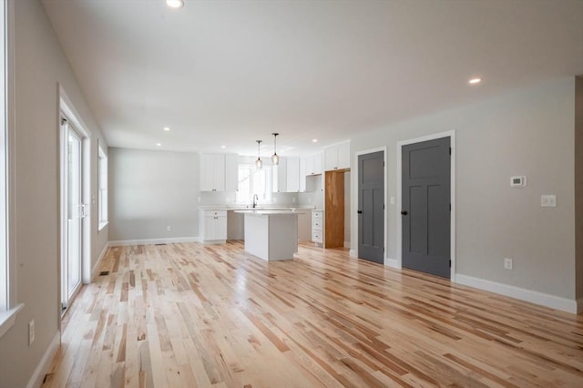 72 N Mast St Unit 1, Goffstown, NH 03045 - unfurnished living room featuring light wood-style floors and recessed lighting