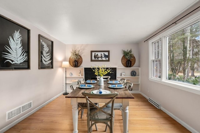 dining space featuring light wood-type flooring