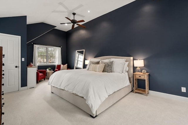 carpeted bedroom featuring ceiling fan and high vaulted ceiling