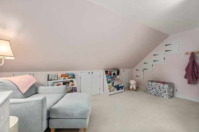 interior space with carpet flooring and vaulted ceiling