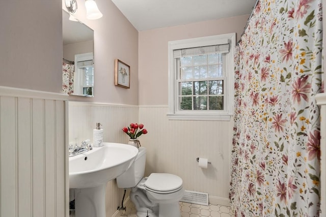 bathroom featuring toilet