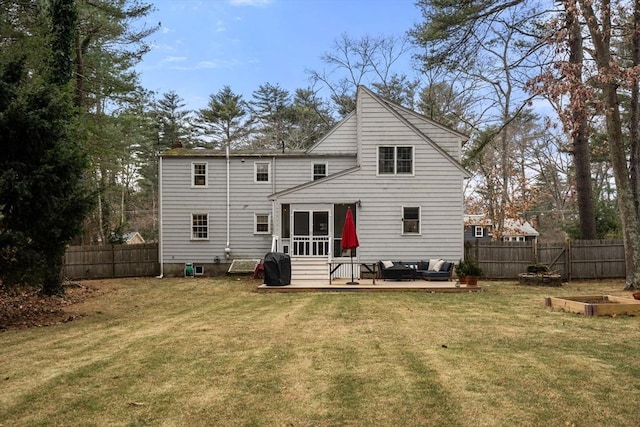 rear view of property featuring an outdoor hangout area, a deck, and a yard