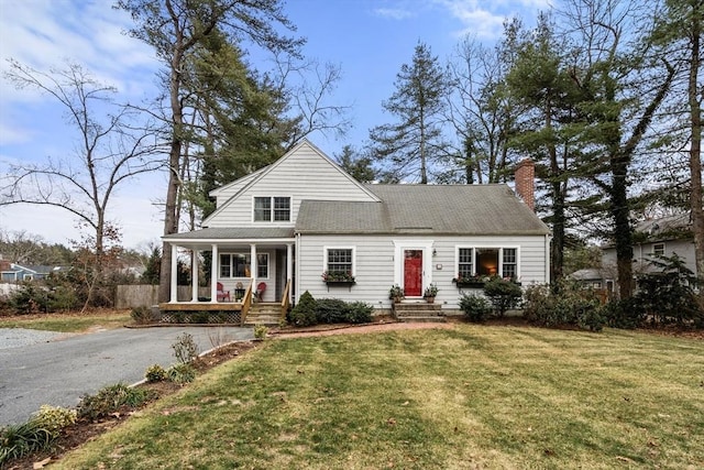 view of front of house featuring a front yard and a porch