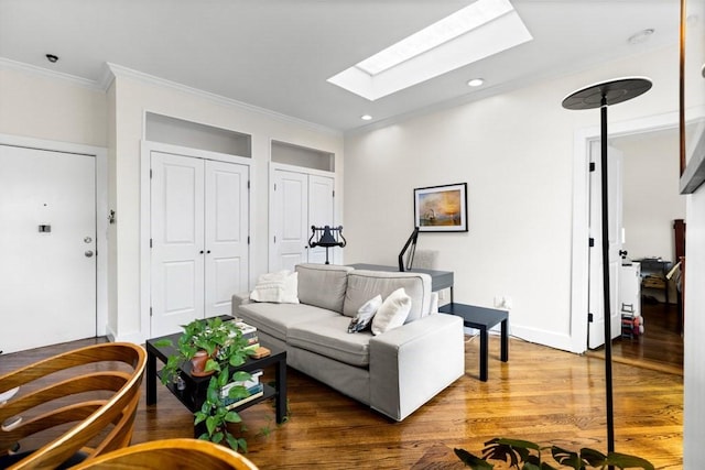 390 Riverway Unit 24, Boston, MA 02115 - living room featuring a skylight, wood finished floors, crown molding, baseboards, and recessed lighting