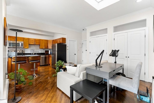 390 Riverway Unit 24, Boston, MA 02115 - living room featuring crown molding, dark wood-style flooring, and a skylight