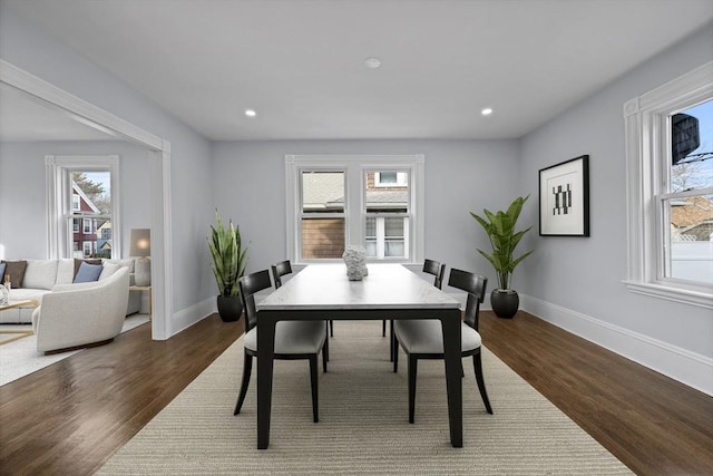 dining space with dark wood-type flooring