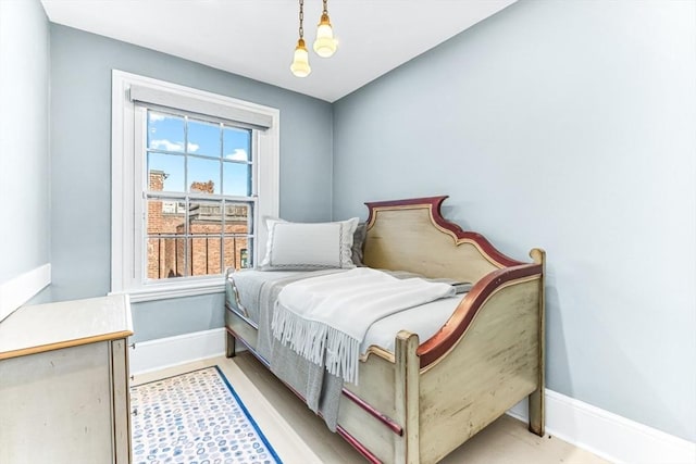 bedroom featuring an inviting chandelier