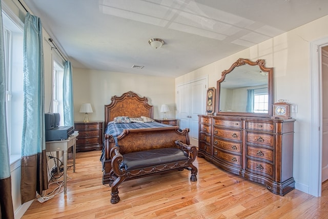 bedroom featuring a closet and light hardwood / wood-style floors