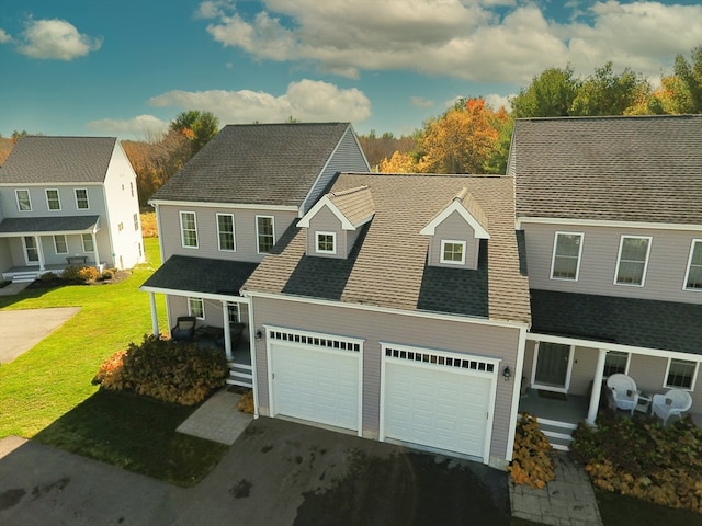 view of front of house featuring a front yard and a garage