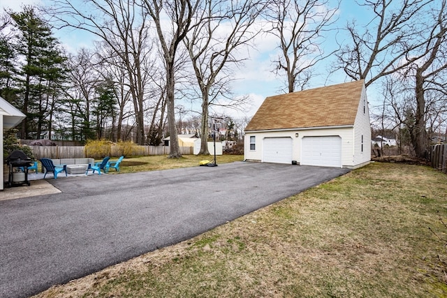 view of yard featuring a garage and a shed