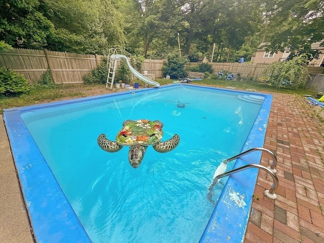156 Patterson St, Attleboro, MA 02703 - view of pool featuring a water slide, a fenced backyard, and a patio area