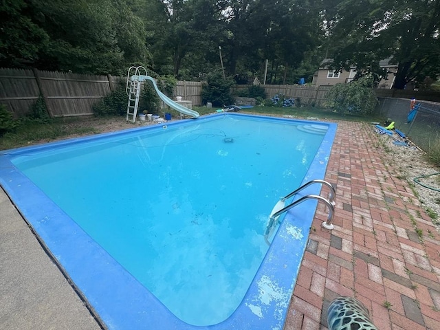 156 Patterson St, Attleboro, MA 02703 - view of swimming pool with a water slide, a fenced backyard, and a patio area