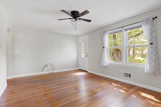 156 Patterson St, Attleboro, MA 02703 - foyer featuring arched walkways, wood-type flooring, ceiling fan, and baseboards