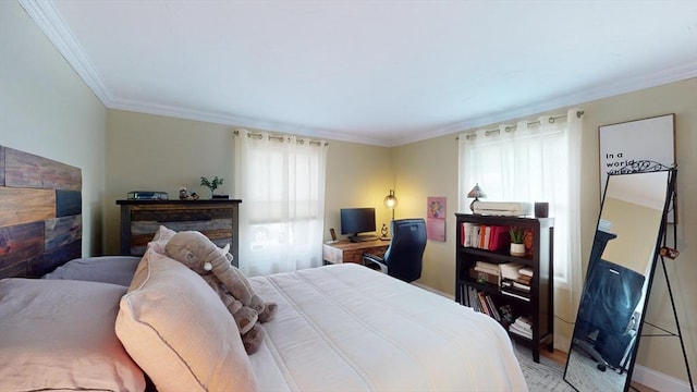 bedroom featuring light wood finished floors and ornamental molding