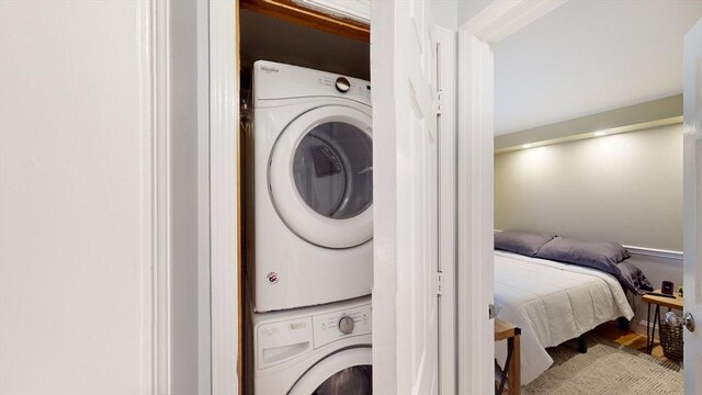 laundry room featuring laundry area and stacked washer and dryer