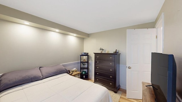 bedroom with recessed lighting and light wood-style flooring