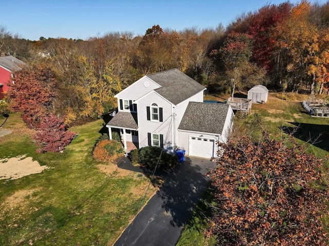 drone / aerial view featuring a view of trees