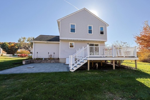 back of house with a patio area, a yard, and a deck