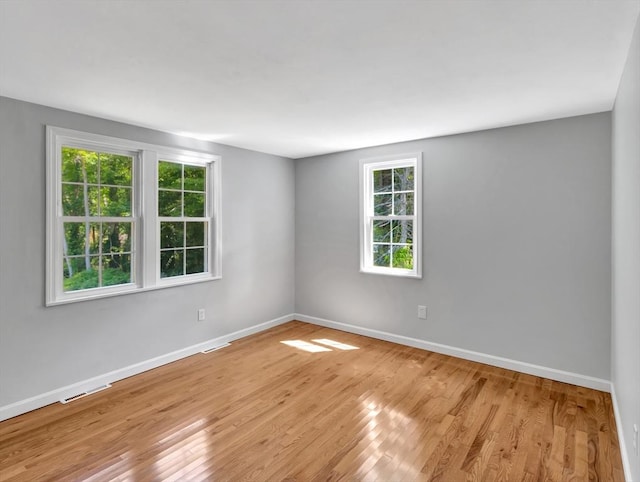 4 Gary Rd, Norton, MA 02766 - empty room featuring healthy amount of natural light and light wood-style flooring