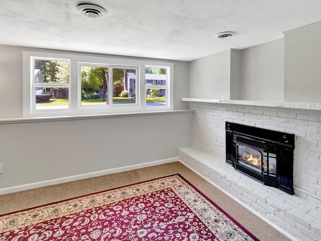 4 Gary Rd, Norton, MA 02766 - unfurnished living room featuring carpet flooring, plenty of natural light, and a fireplace