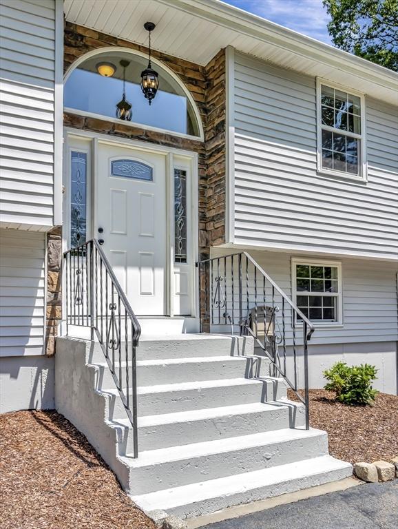 4 Gary Rd, Norton, MA 02766 - doorway to property featuring stone siding