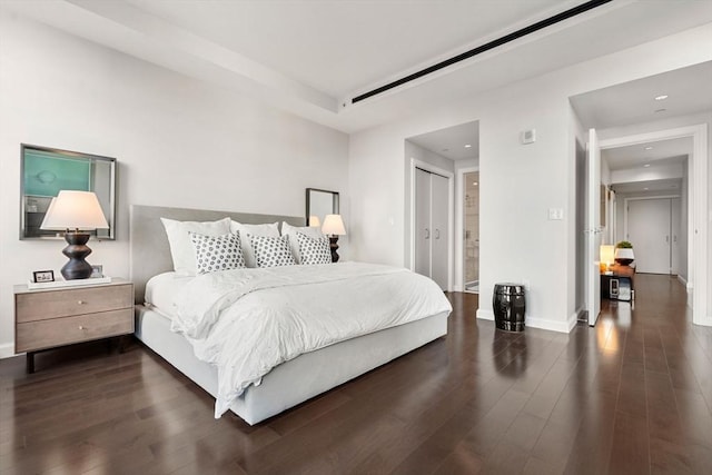 bedroom featuring recessed lighting, baseboards, and dark wood finished floors