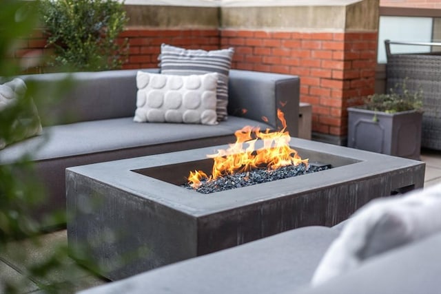 view of patio / terrace with an outdoor fire pit