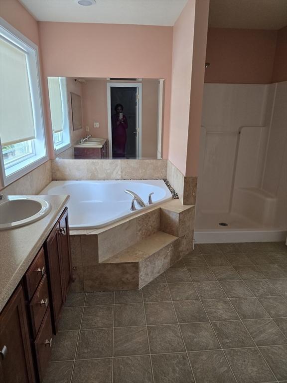 62 Saint Anthony St, Fitchburg, MA 01420 - bathroom featuring vanity, a garden tub, and a shower