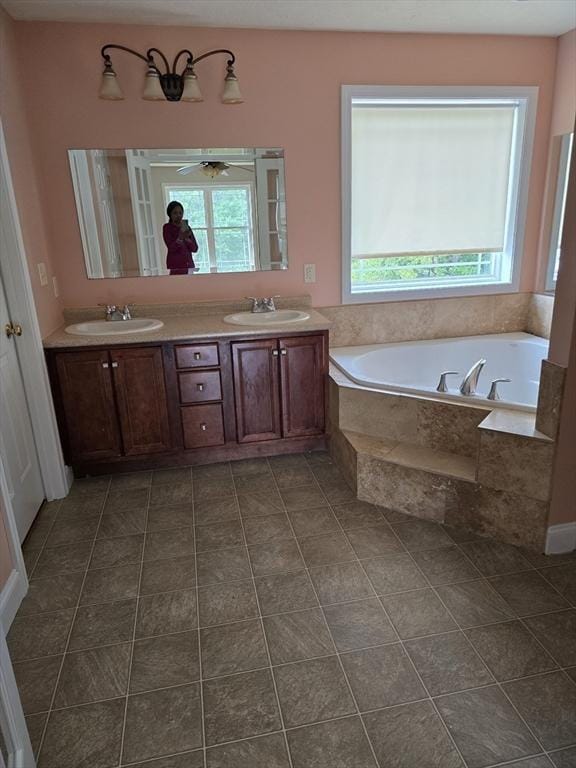 62 Saint Anthony St, Fitchburg, MA 01420 - bathroom with healthy amount of natural light, a garden tub, and double vanity