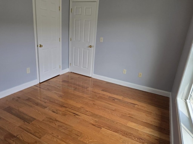 62 Saint Anthony St, Fitchburg, MA 01420 - unfurnished bedroom with wood finished floors and baseboards