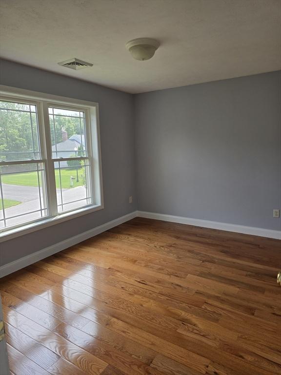62 Saint Anthony St, Fitchburg, MA 01420 - spare room with hardwood / wood-style floors and baseboards