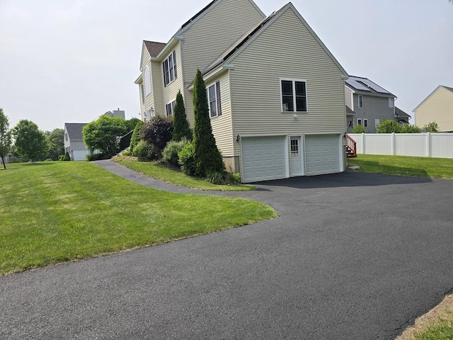 62 Saint Anthony St, Fitchburg, MA 01420 - view of property exterior featuring driveway and a garage
