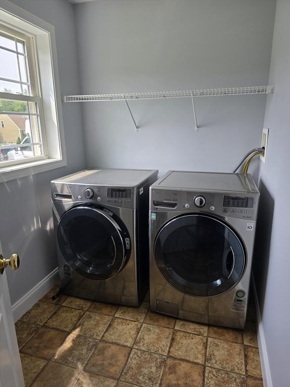62 Saint Anthony St, Fitchburg, MA 01420 - laundry room with washer and dryer and stone tile floors