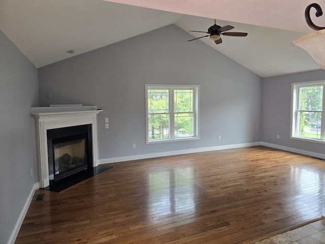 62 Saint Anthony St, Fitchburg, MA 01420 - unfurnished living room featuring lofted ceiling, hardwood / wood-style flooring, ceiling fan, and a fireplace with flush hearth
