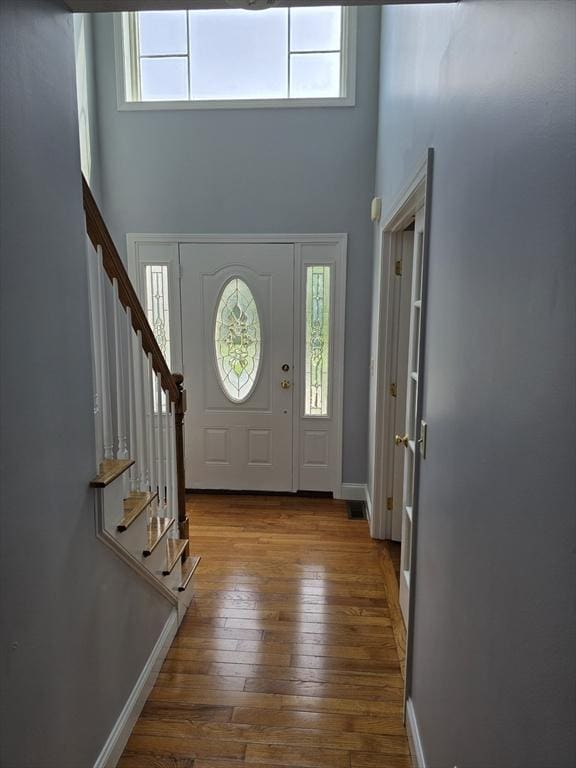 62 Saint Anthony St, Fitchburg, MA 01420 - entryway with a towering ceiling, plenty of natural light, stairway, and wood-type flooring