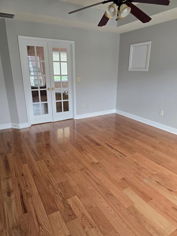 62 Saint Anthony St, Fitchburg, MA 01420 - unfurnished room featuring french doors, ceiling fan, and hardwood / wood-style flooring