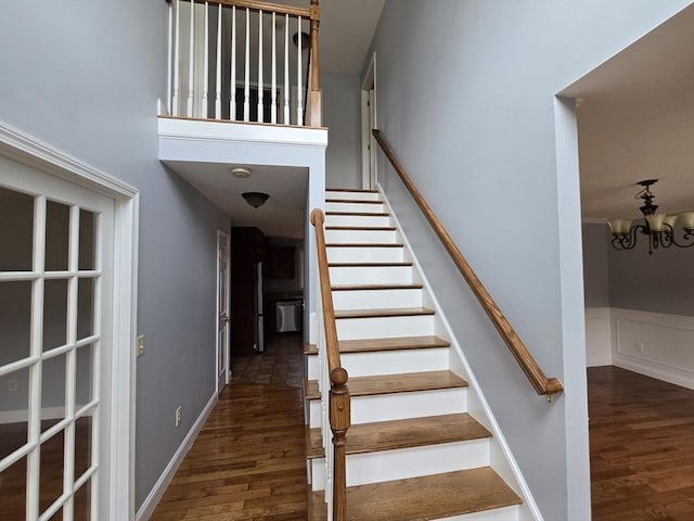 62 Saint Anthony St, Fitchburg, MA 01420 - stairway featuring wood finished floors and a chandelier