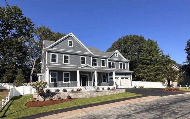 view of front of house featuring covered porch and a garage