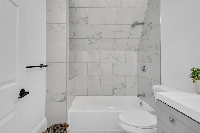 full bathroom featuring vanity, toilet, and tiled shower / bath