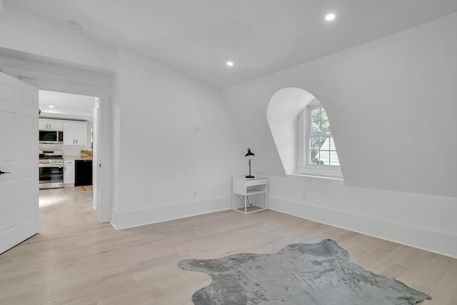 spare room with light wood-type flooring