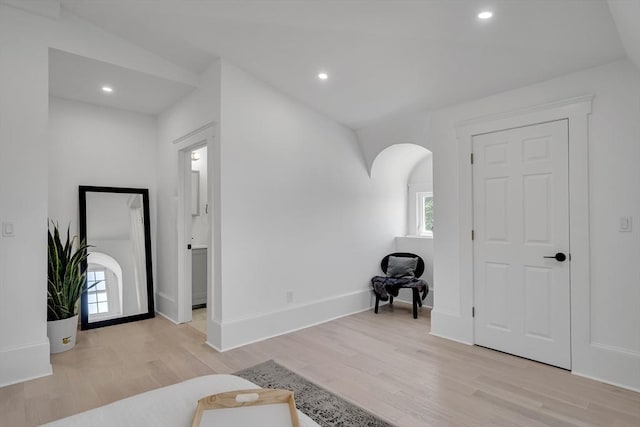 foyer featuring light hardwood / wood-style flooring and vaulted ceiling