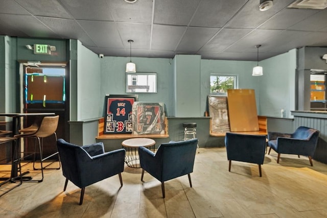 sitting room with a paneled ceiling