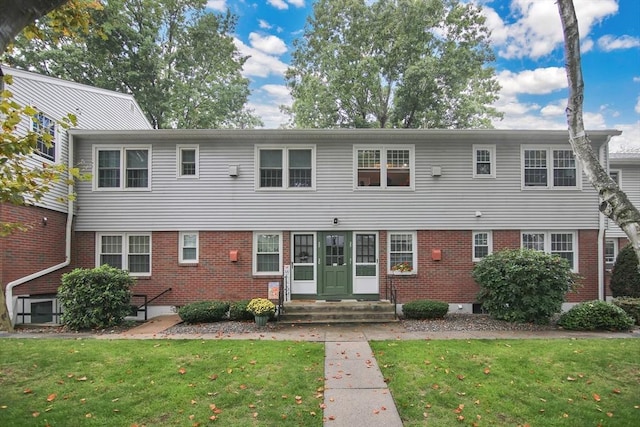 80 Brush Hill Ave Unit 33, West Springfield, MA 01089 - back of house with brick siding, entry steps, and a yard