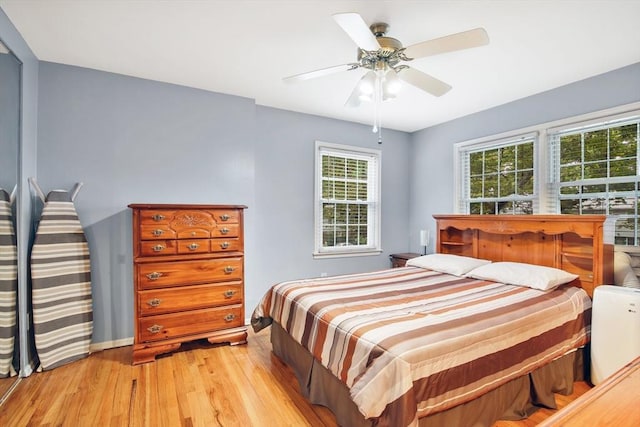 80 Brush Hill Ave Unit 33, West Springfield, MA 01089 - bedroom with light wood-style floors, multiple windows, and ceiling fan