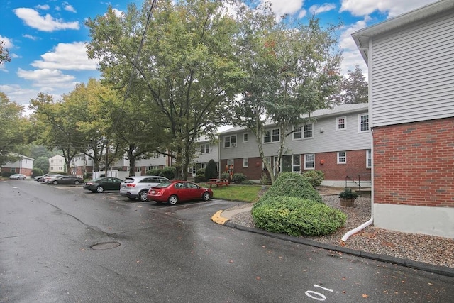 80 Brush Hill Ave Unit 33, West Springfield, MA 01089 - view of building exterior featuring uncovered parking and a residential view