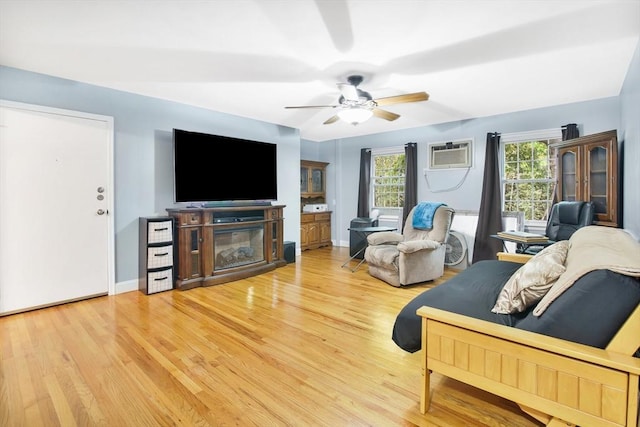 80 Brush Hill Ave Unit 33, West Springfield, MA 01089 - living area featuring wood finished floors, a ceiling fan, a wall mounted air conditioner, and baseboards