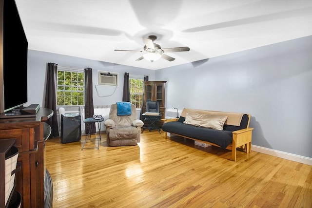 80 Brush Hill Ave Unit 33, West Springfield, MA 01089 - living area featuring wood finished floors, a ceiling fan, a wall unit AC, and baseboards