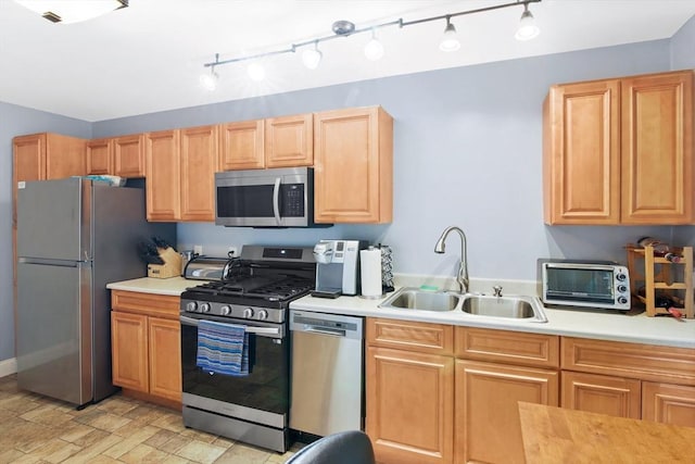 80 Brush Hill Ave Unit 33, West Springfield, MA 01089 - kitchen with stainless steel appliances, a sink, light countertops, and rail lighting